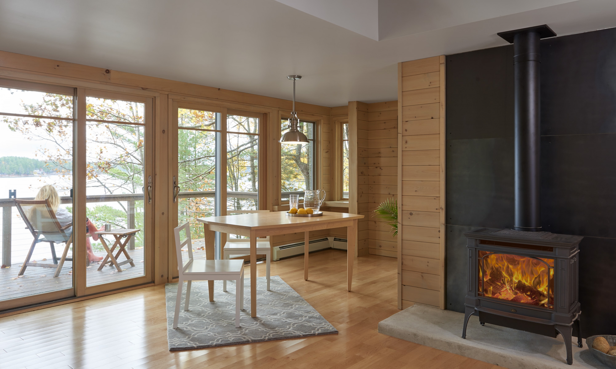 Dining, Gas stove Gas stove, maple flooring, lake view, Maine Architect, Concrete hearth