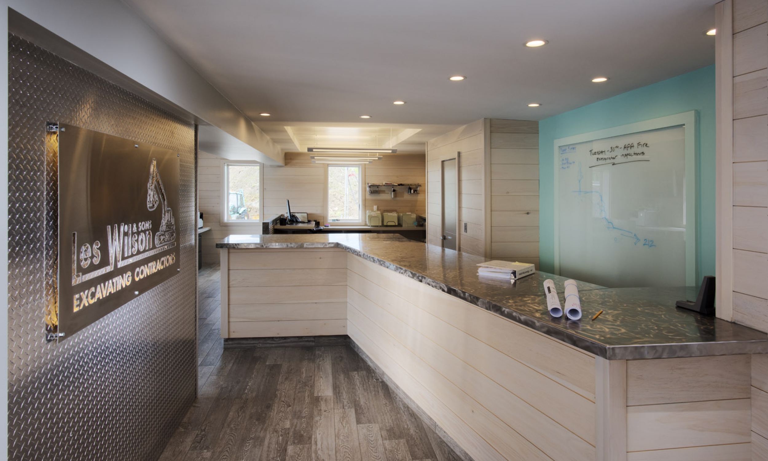 Entrance, Serpentine Desk Entrance, Serpentine Desk, Stainless steel counter, diamond plate wall finish, Maine Architect