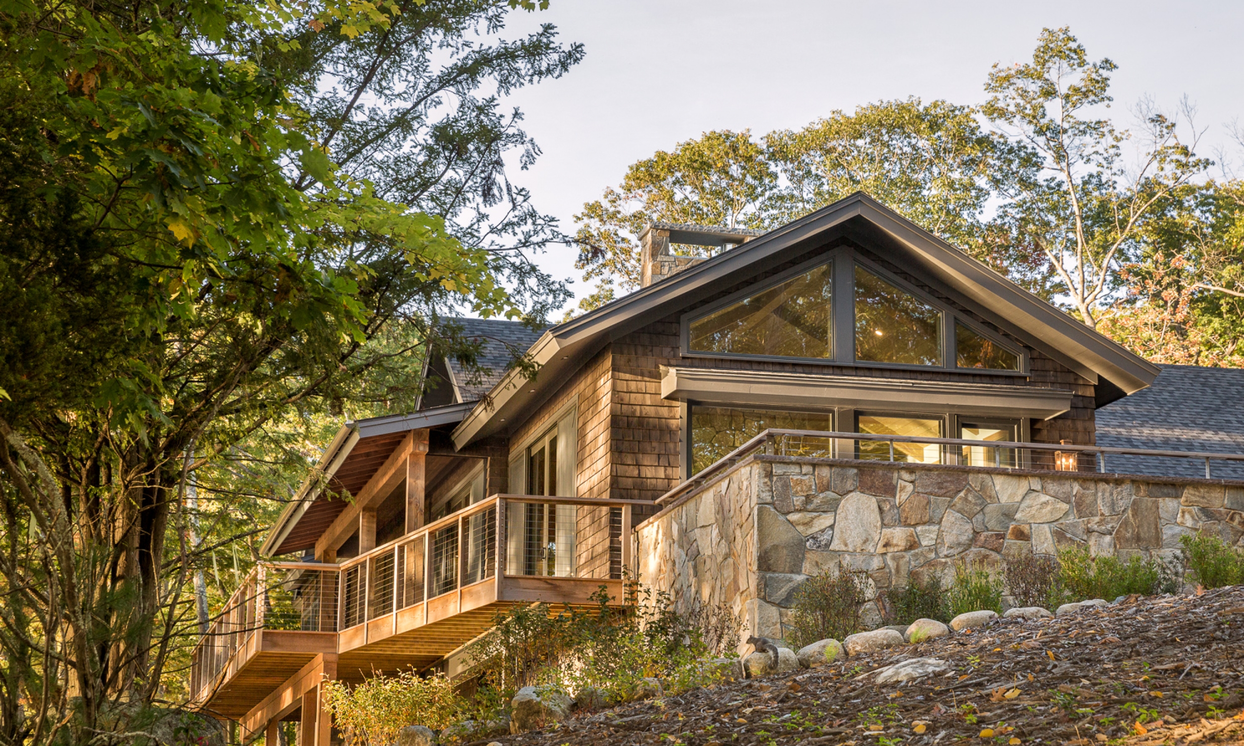 View to the stone patio New England architecture, natural living, maine architect, outdoor living, waterfront home
