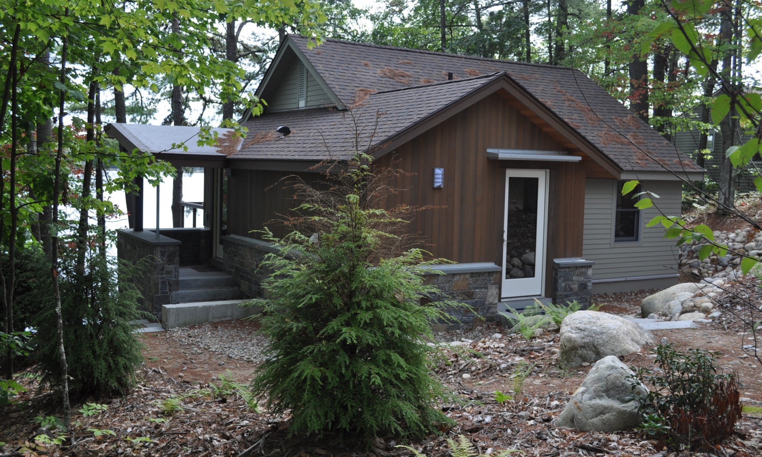 Wooded front entrance Red cedar siding, stone, American Granite, Maine Architect, Wood stain